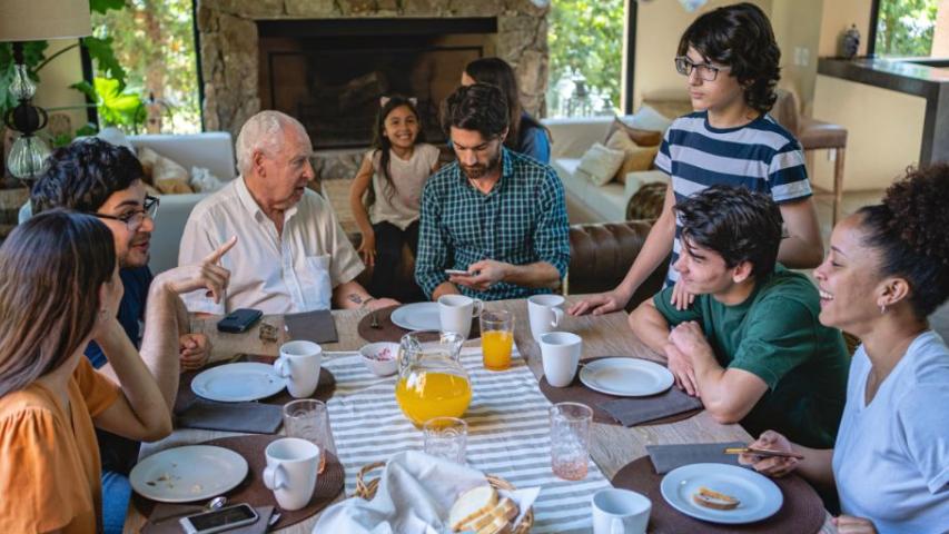family sitting down have a meal